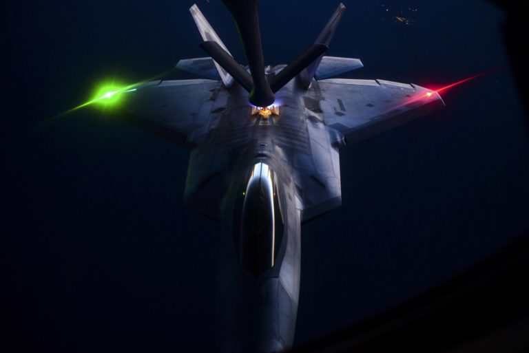 An F-22 Raptor is refueled by a KC-135 Stratotanker over the Nevada Test and Training Range during the U.S. Air Force Weapons School’s Deliberate Strike Night, June 16, 2016. The exercise is part of the final seven-day advanced integration portion of the school’s curriculum, testing stealth and conventional airframes’ abilities to conduct attacks during the hours after sunset. (U.S. Air Force photo/Airman 1st Class Kevin Tanenbaum)