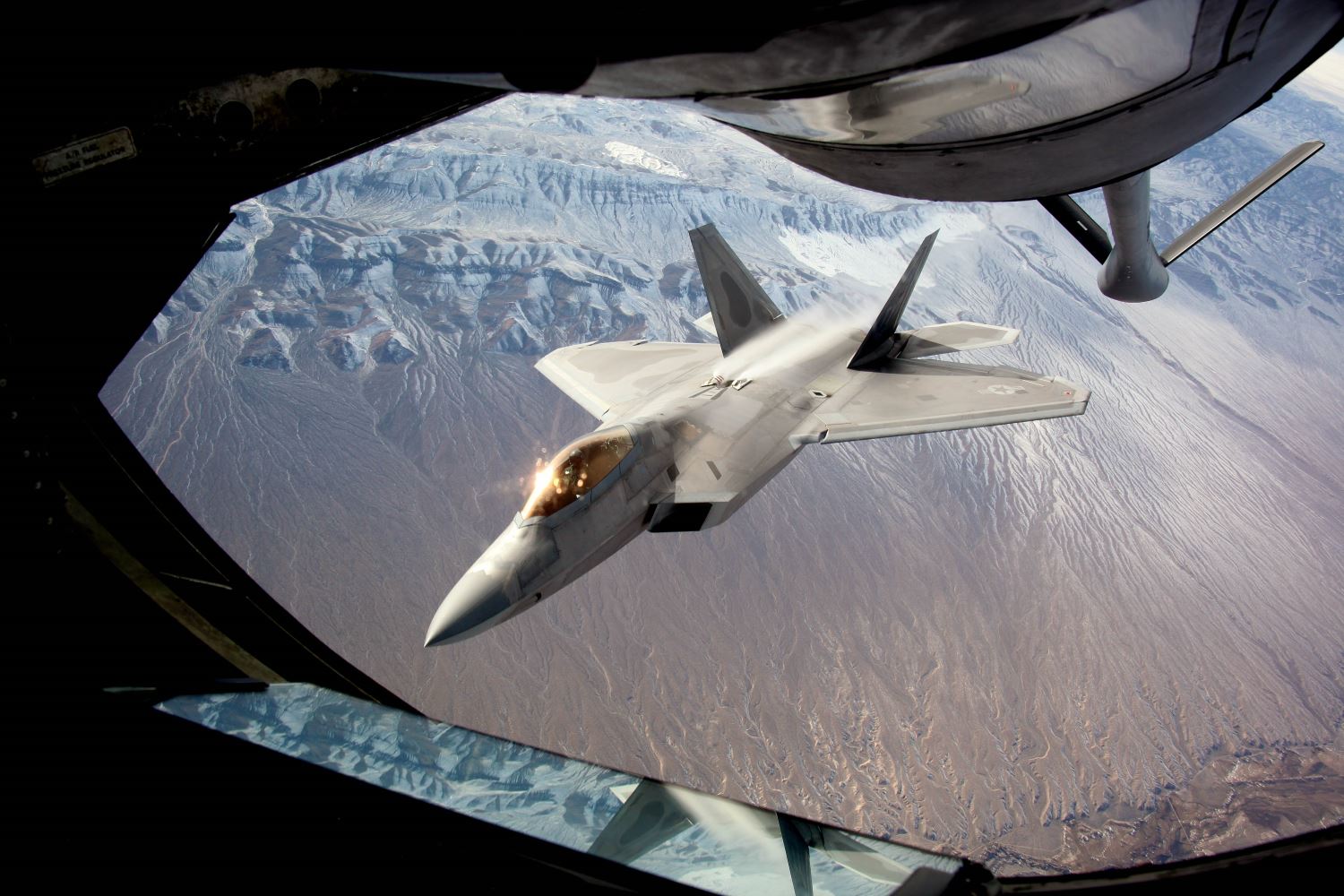 An F-22 Raptor, assigned to the 95th Fighter Squadron at Tyndall Air Force Base, Fla., disconnects from the boom of a KC-135 Stratotanker after receiving fuel to continue on its training sortie during exercise Red Flag 16-1 Feb. 4, 2016. The high-tempo exercise incorporates both day and night missions that give aircrews an opportunity to experience advanced, relevant, and realistic combat-like situations in a controlled environment to increase their ability to complete missions and safely return home. (U.S. Air Force photo/Master Sgt. Burt Traynor)